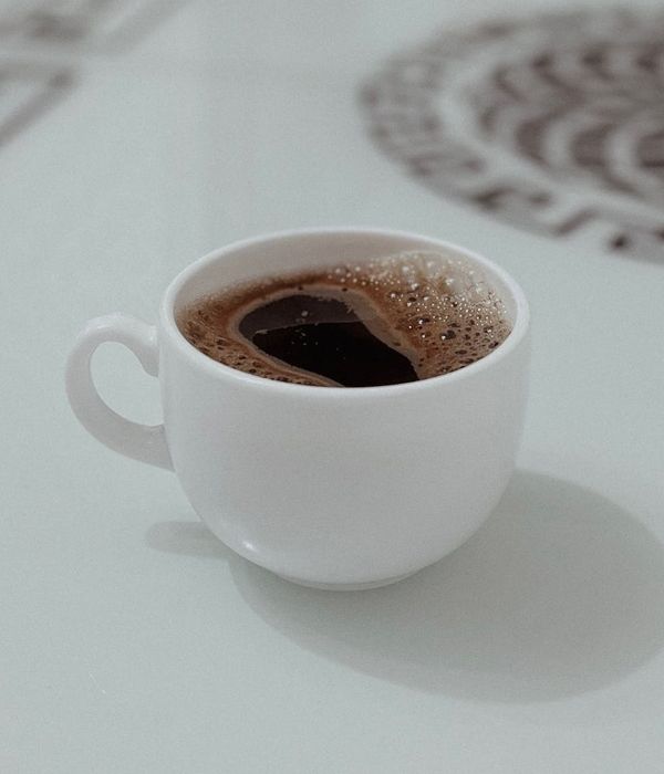 A person looking refreshed and full of energy against a minimalist background.